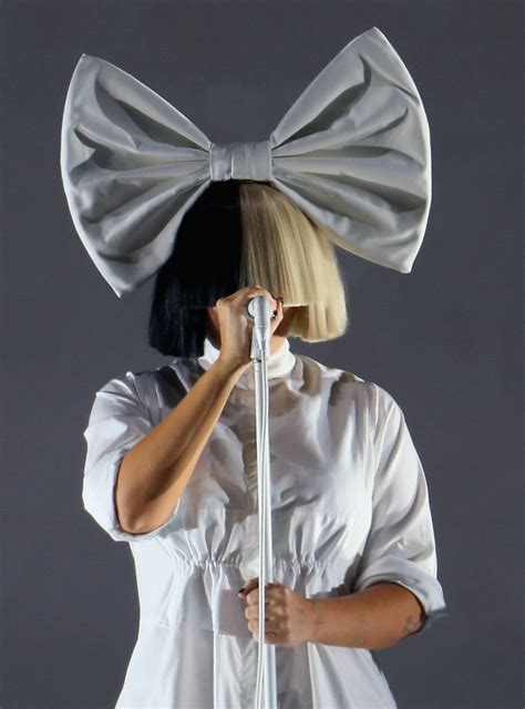 Why Does Sia Cover Her Face With a Wig? Here’s the Answer | Allure