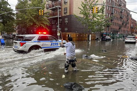 New York swamped by record-breaking rainfall as more downpours expected ...