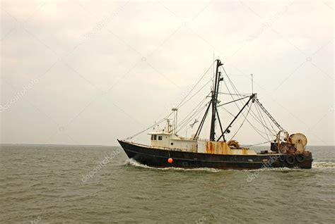 Old, rusty fishing trawler in early morning mist — Stock Photo ...