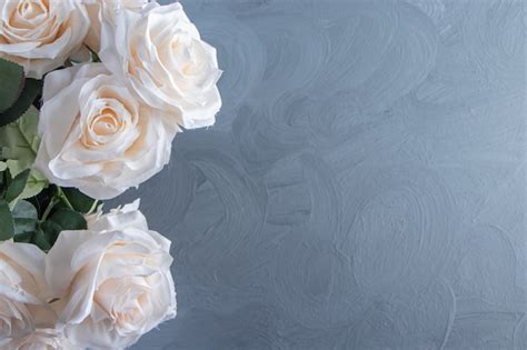 Free Photo | A bouquet of white flowers in a bucket, on the white table.