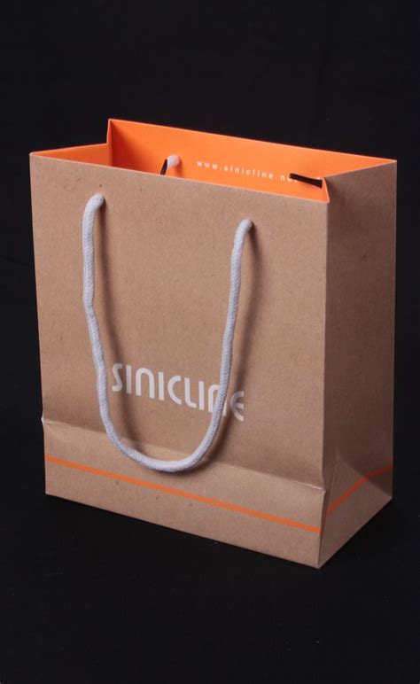 an orange and white paper bag with the word sincub on it's side