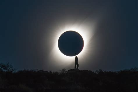 Photographer Captures Perfect Shot of Person 'Holding' the Total Solar ...