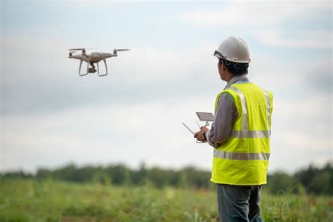 Premium Photo | Construction engineer control drone survey land for ...