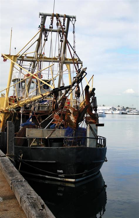 Fishing trawler in a harbor 2215589 Stock Photo at Vecteezy