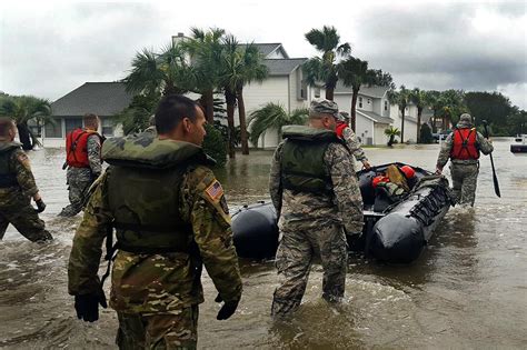 Guard members carry out search and rescue operations as Hurricane ...