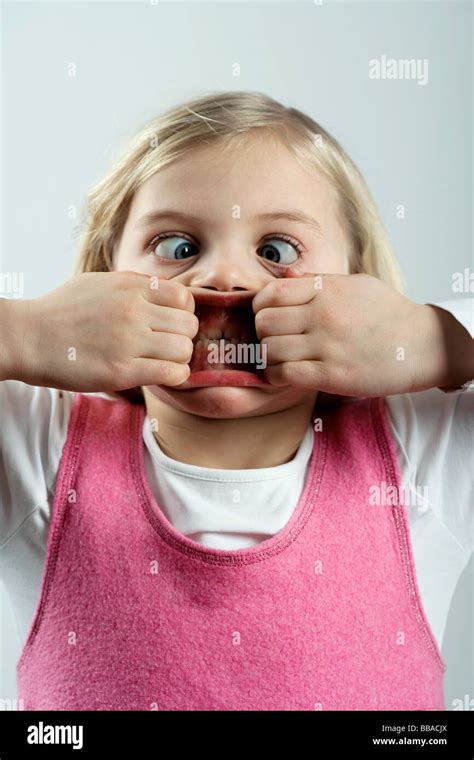 A little girl making a scary face Stock Photo - Alamy