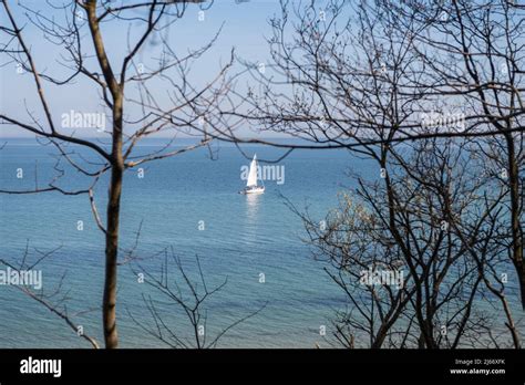 Blue sky without clouds with clear water and sailboards away from the ...