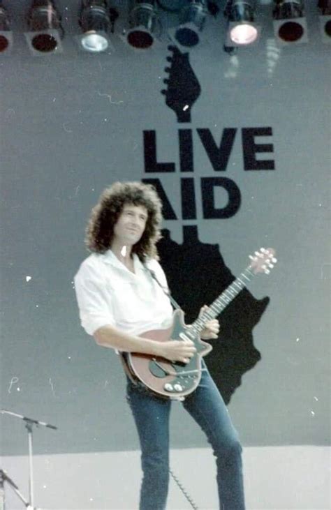 Brian May of Queen performing in Live Aid (1985) : r/OldSchoolCelebs