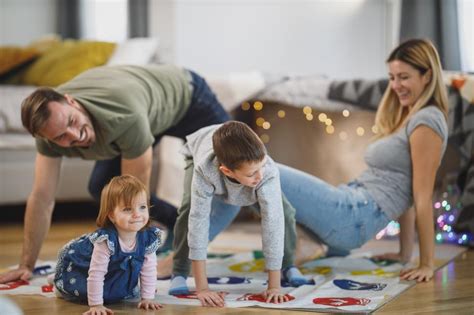 Free Stock Photo of Young parents playing with their kids at home ...