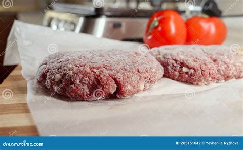 Frozen Hamburger Patties and Ingredients Lying on Kitchen Table Next To ...