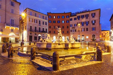 Piazza navona square at night rome italy featuring fountain of neptune ...