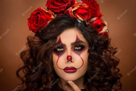 Free Photo | Woman in devil halloween makeup with flower beads