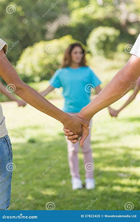 Group of Friends Holding Hands in Park Stock Photo - Image of bond ...