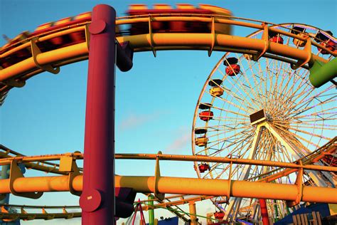 Amusement park rides on a pier Photograph by Celso Diniz - Fine Art America