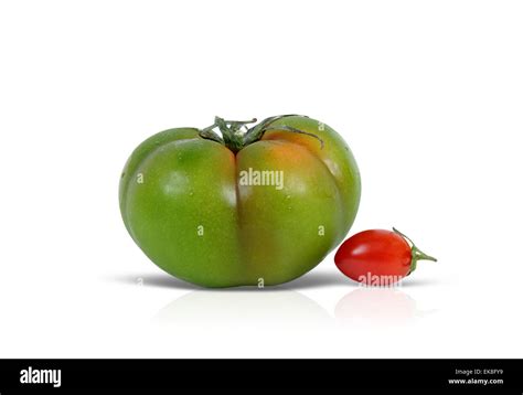 Green and red tomato Stock Photo - Alamy