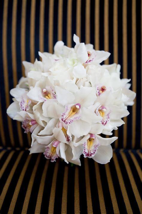 white orchid bridal bouquet with touches of pink