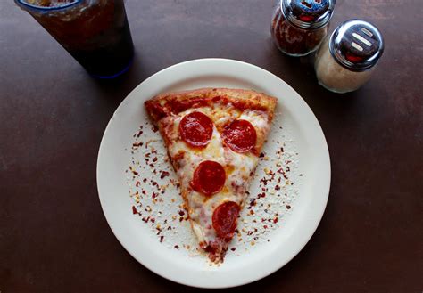 Sliced Pepperoni Pizza on White Ceramic Plate · Free Stock Photo