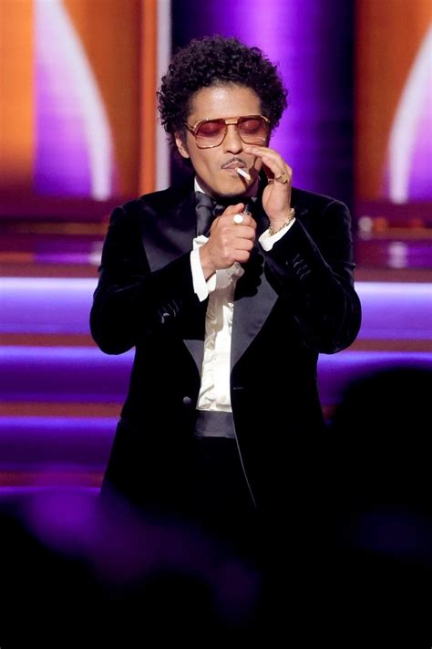 Watch Bruno Mars Light a Cigarette While Accepting a 2022 Grammy