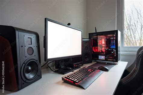 Custom built gaming computer with white screen, keyboard, mouse ...