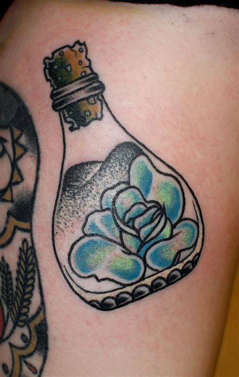 rose in a bottle tattoo by noodles | Bottle tattoo, Tea tattoo, Tattoos