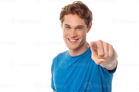 Cheerful man pointing towards camera 944512 Stock Photo at Vecteezy