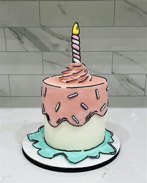 a birthday cake decorated with sprinkles and a candle