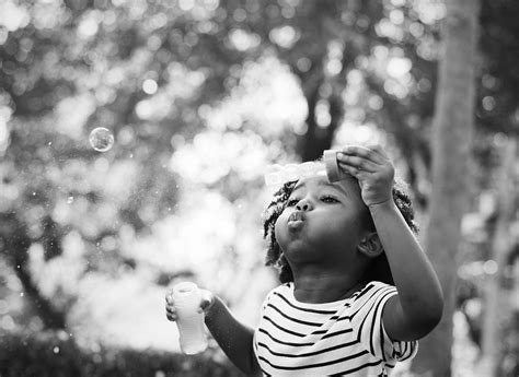 African kid playing with bubbles | Free Photo - rawpixel