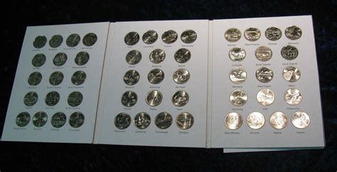 259. (50) State Complete Commemorative Quarter Set in Marcus Coin Book.