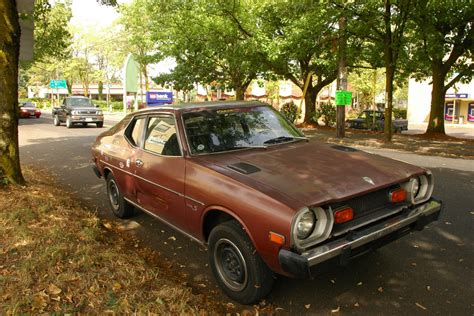 OLD PARKED CARS.: 1976 Datsun F10 Hatchback.