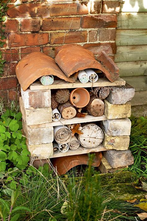 Homemade bug hotel garden craft. Got the bricks, drill and "stuff ...