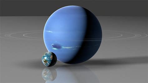 Earth Compared To Neptune Photograph by Mark Garlick/science Photo ...