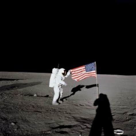 Astronaut On Moon By The American Flag