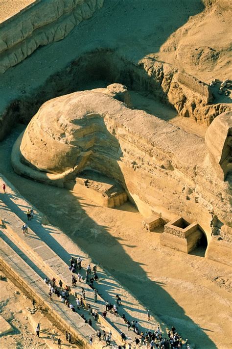 an aerial view of people walking around in front of the sphinx ruins at ...