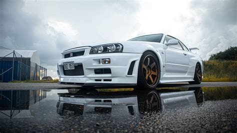 Download The Unbeatable Pearl White Nissan Skyline GTR R34 Wallpaper ...