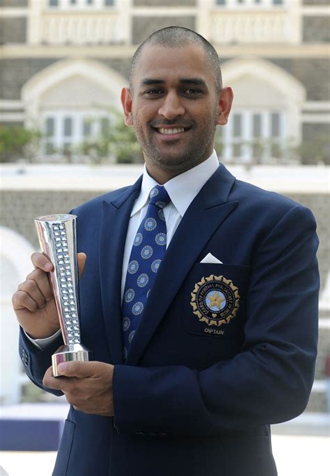 MS Dhoni with the Man-of-the-Match trophy he picked up in the World Cup ...