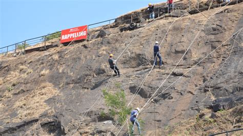 Enjoy rappelling down a vertical faced rock at Della Adventure