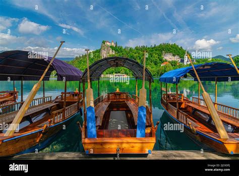 Traditional Pletna boat on the Bled lake. In the background is the ...