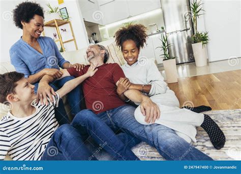 Family Watching TV Together at Home and Having Fun Together Stock Photo ...