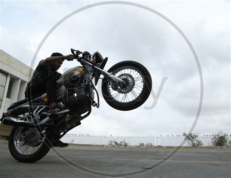 Image of A Biker Performing Stunts On Bike-LU691701-Picxy