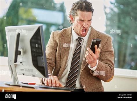 Man stressed out at work Stock Photo - Alamy