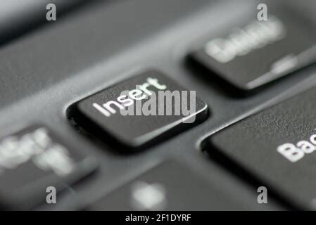 Insert key on a laptop keyboard Stock Photo - Alamy