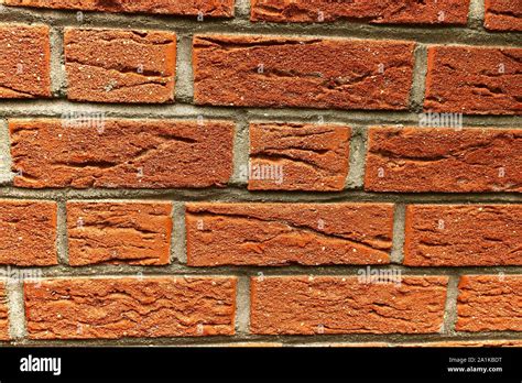 Texture of a carmine red stone wall on a house Stock Photo - Alamy