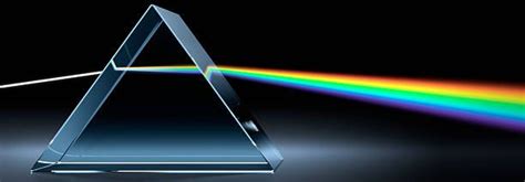 Refraction. White light being refracted as it passes through a ...