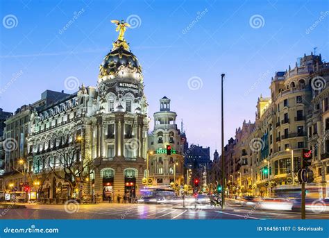 Madrid, Metropolis Building and Gran Via at Night Editorial Photography ...