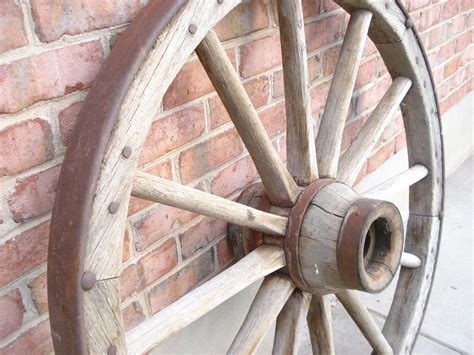 Just a bed of Roses: Antique wagon wheel $150.00