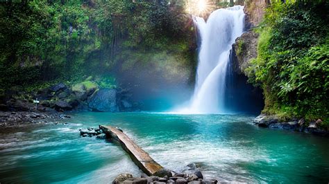 Beautiful Waterfall Between Rocks Pouring On River In Sunbeam ...