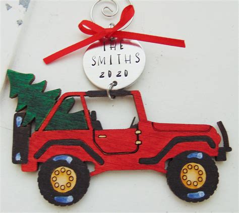 a christmas ornament with a red jeep