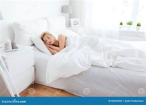 Young Woman Sleeping In Bed At Home Bedroom Stock Photo - Image: 68436506