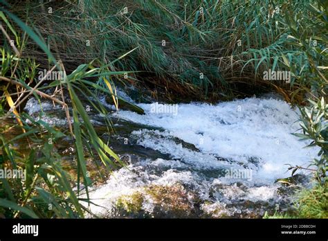 River of turbulent waters in a small waterfall, Long exposure ...