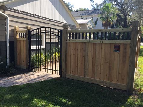 Custom wood privacy fence and scalloped aluminum gate designed and ...